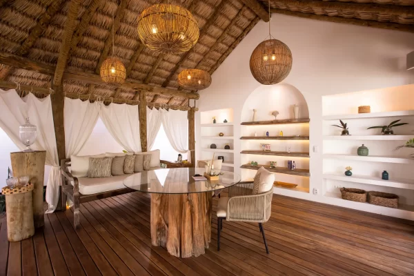 Preabeach spa lounge with glass coffee table on a tree-trunk base