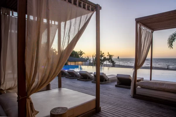 Private cabanas at Yemanja at sunset, overlooking the infinity pool and ocean